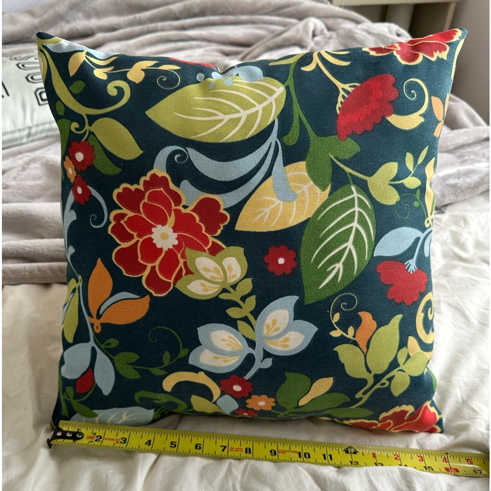 Floral pillow with design on both sides